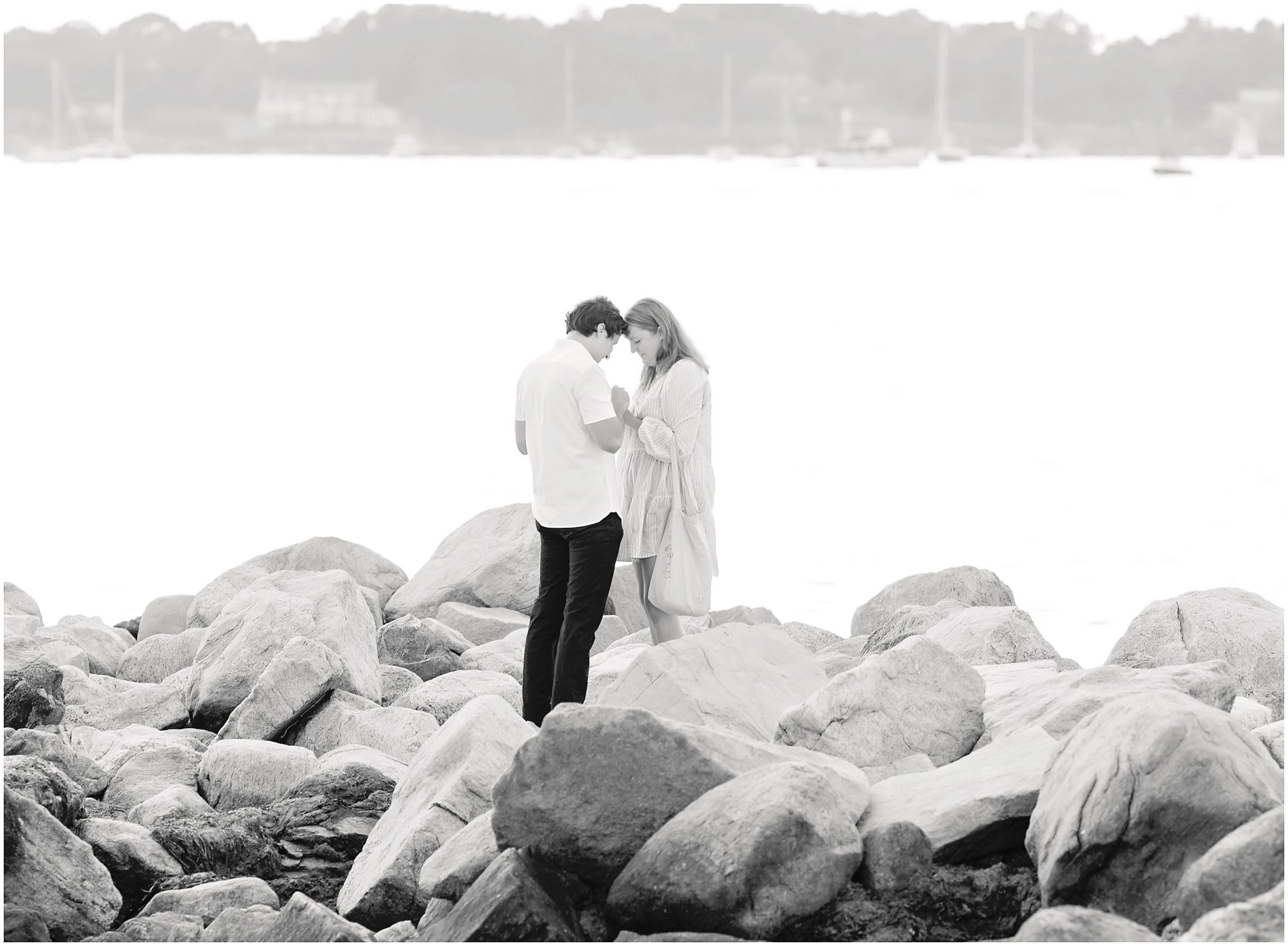 beach proposal on the rocks
