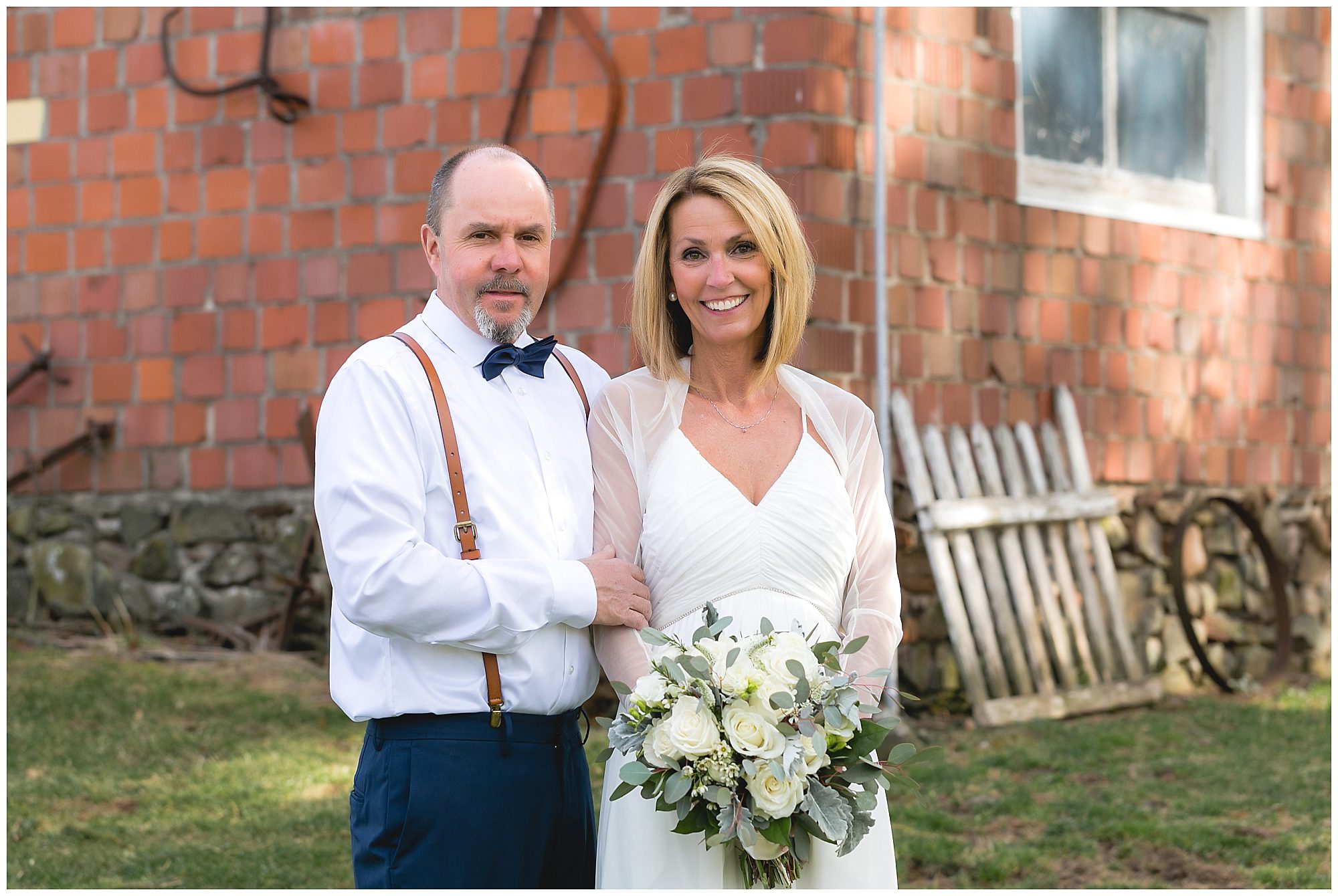 bride and groom with white bouquet