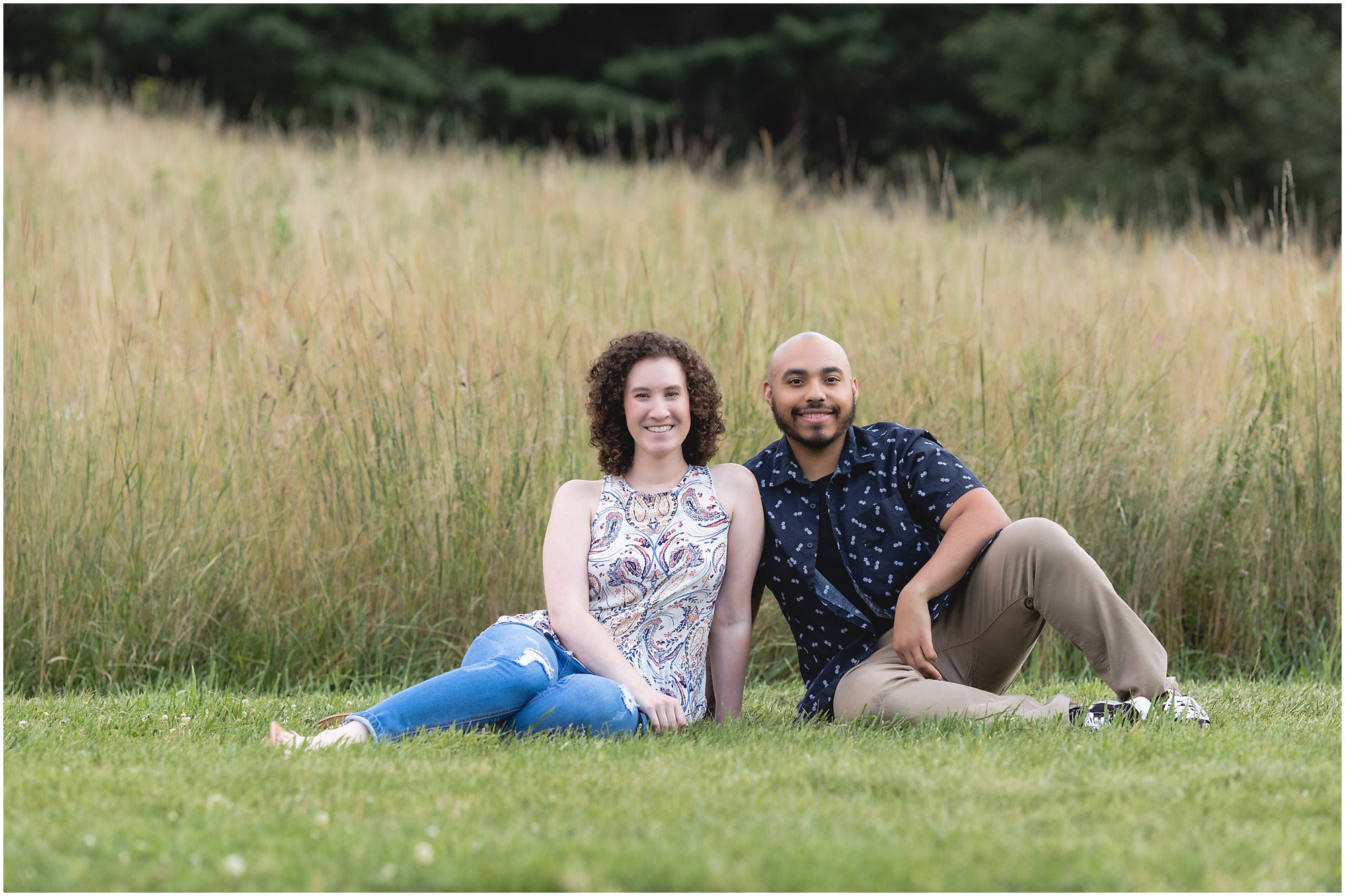 engaged couple in a field