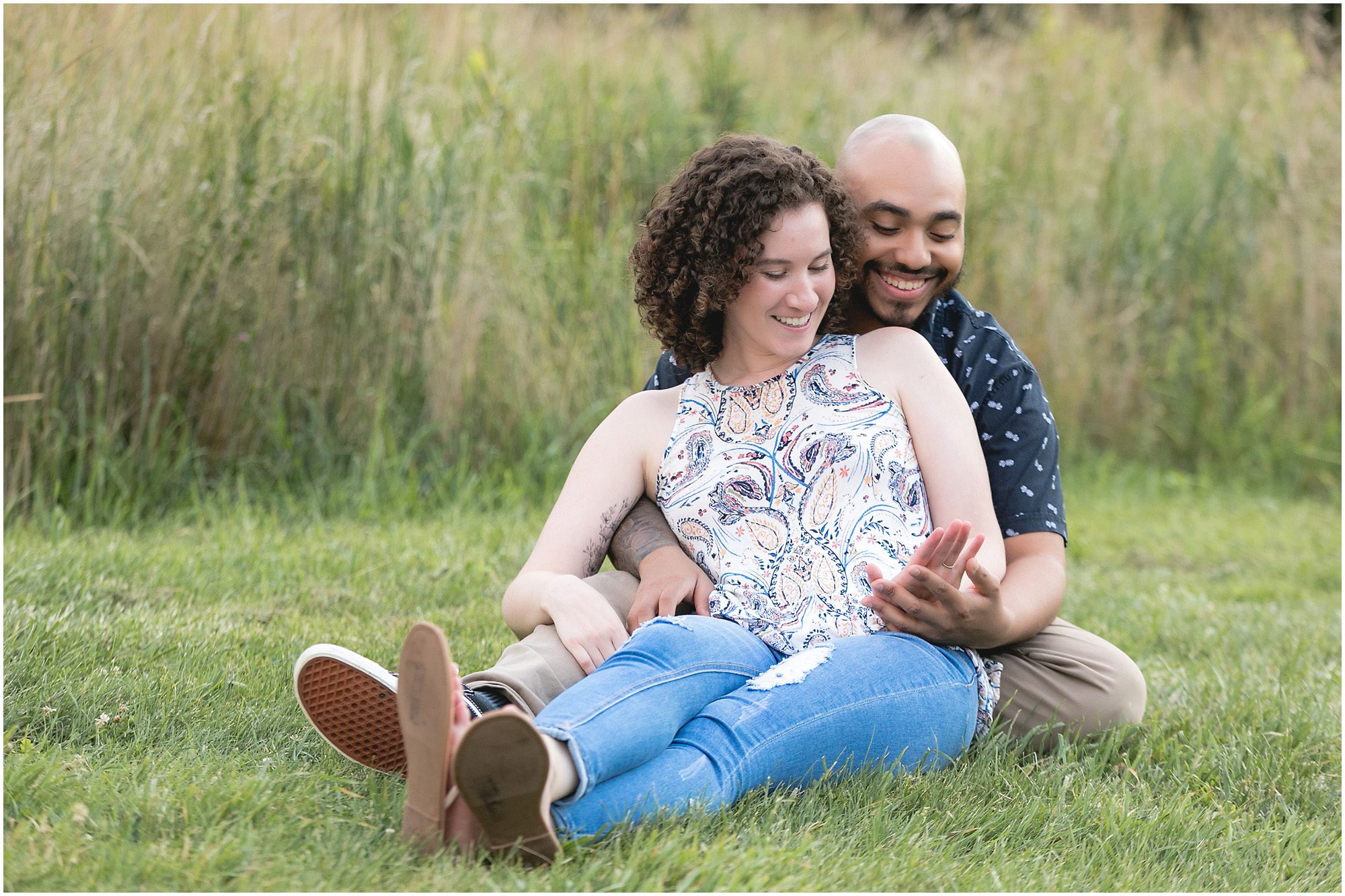 engaged couple looking at ring