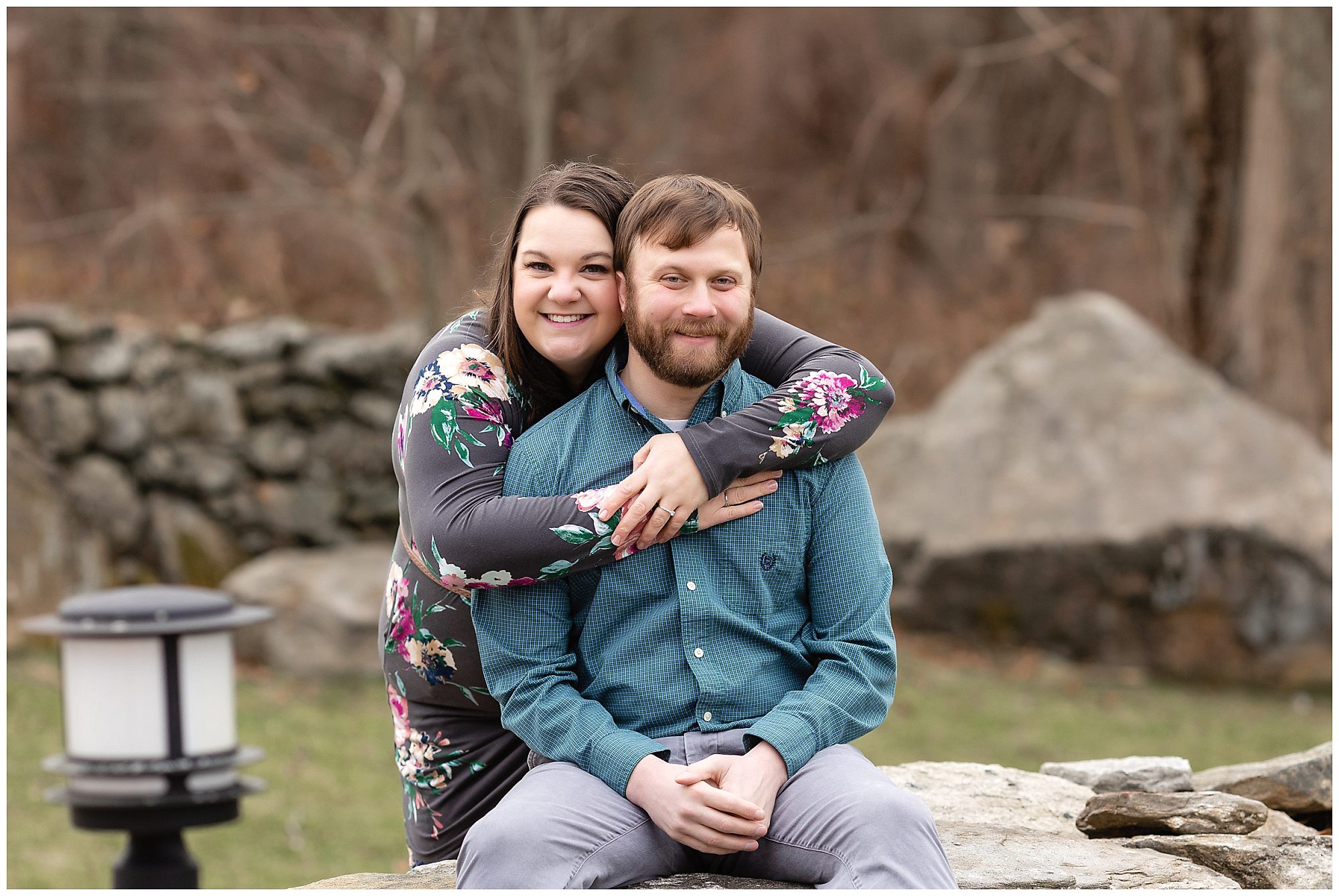 couple on rock wall
