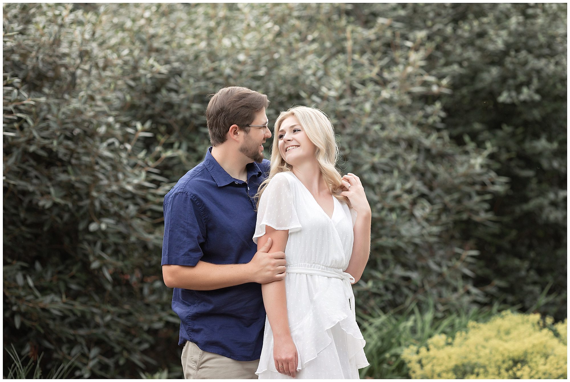 engaged couple looking at each other