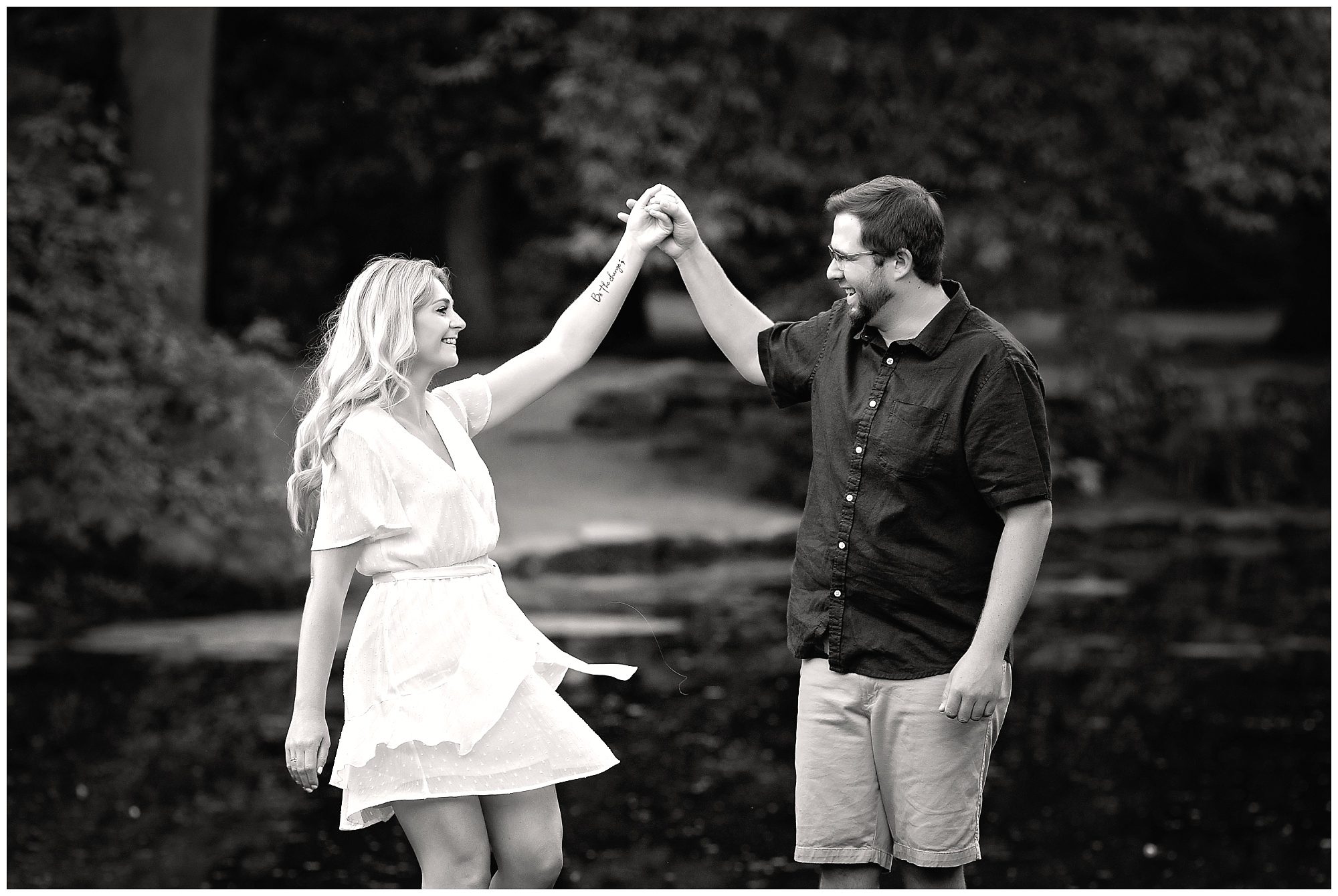 engaged couple twirling