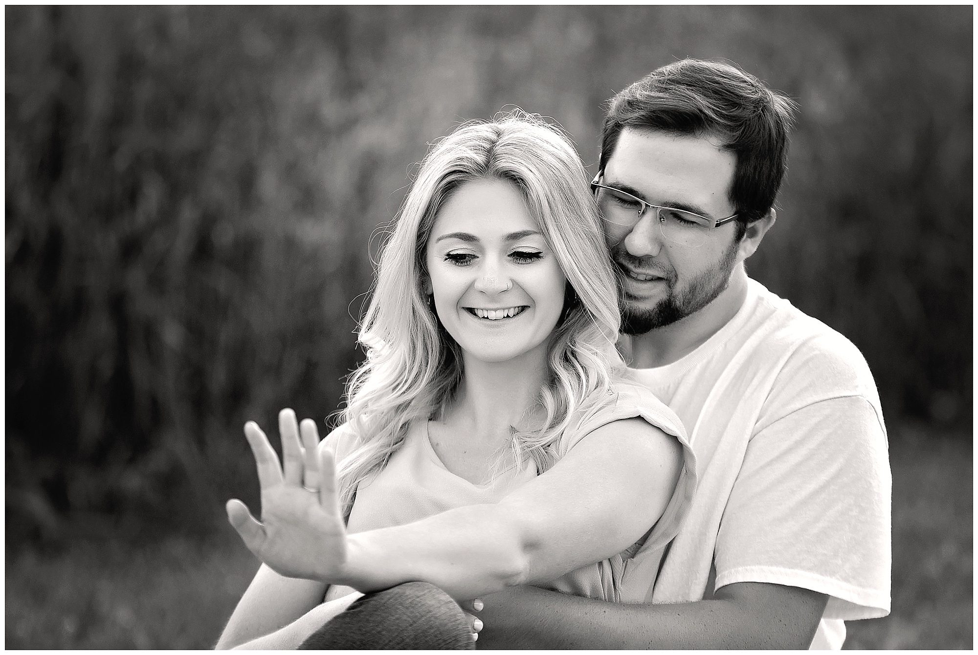 engaged couple looking at ring