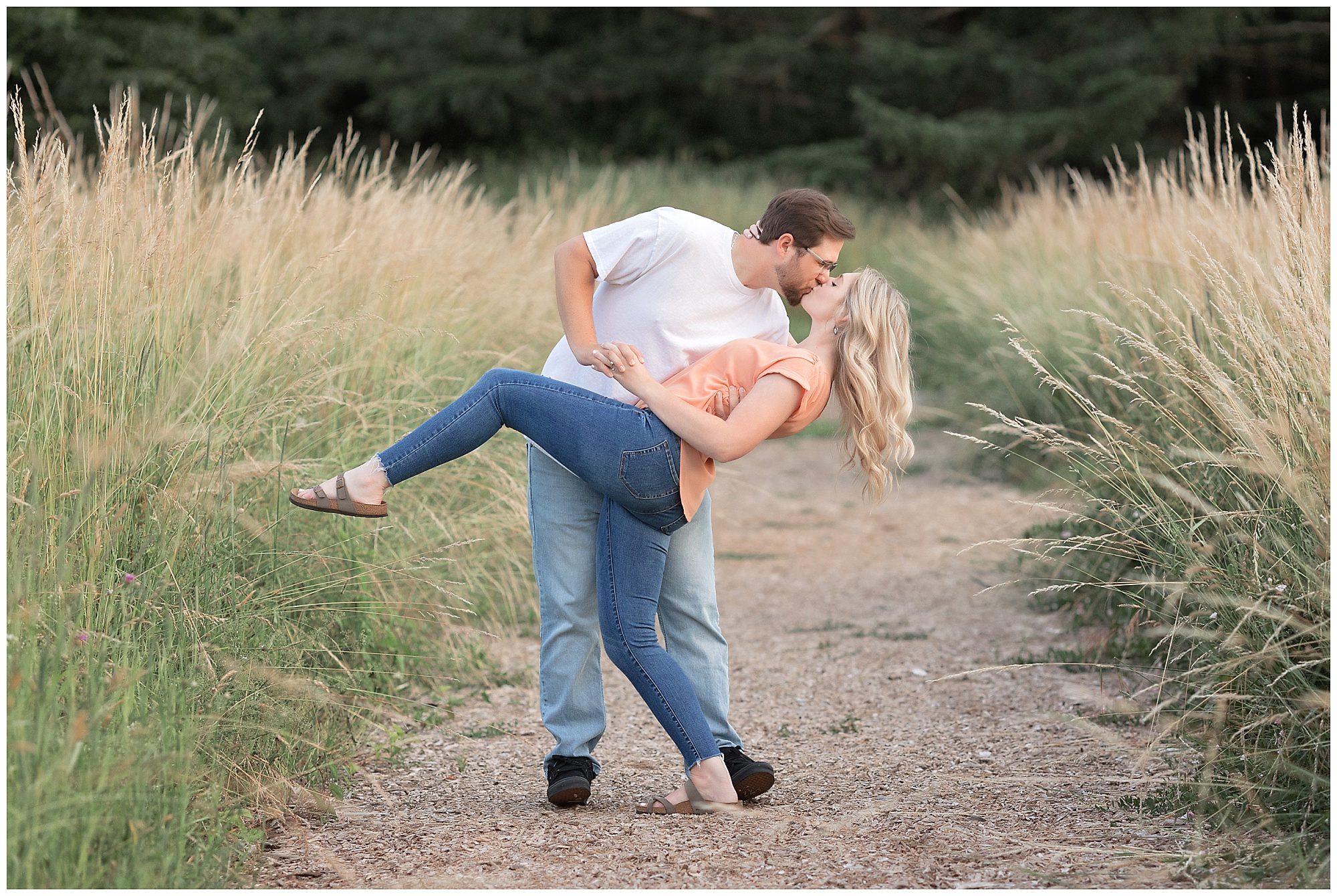 engaged couple in a field