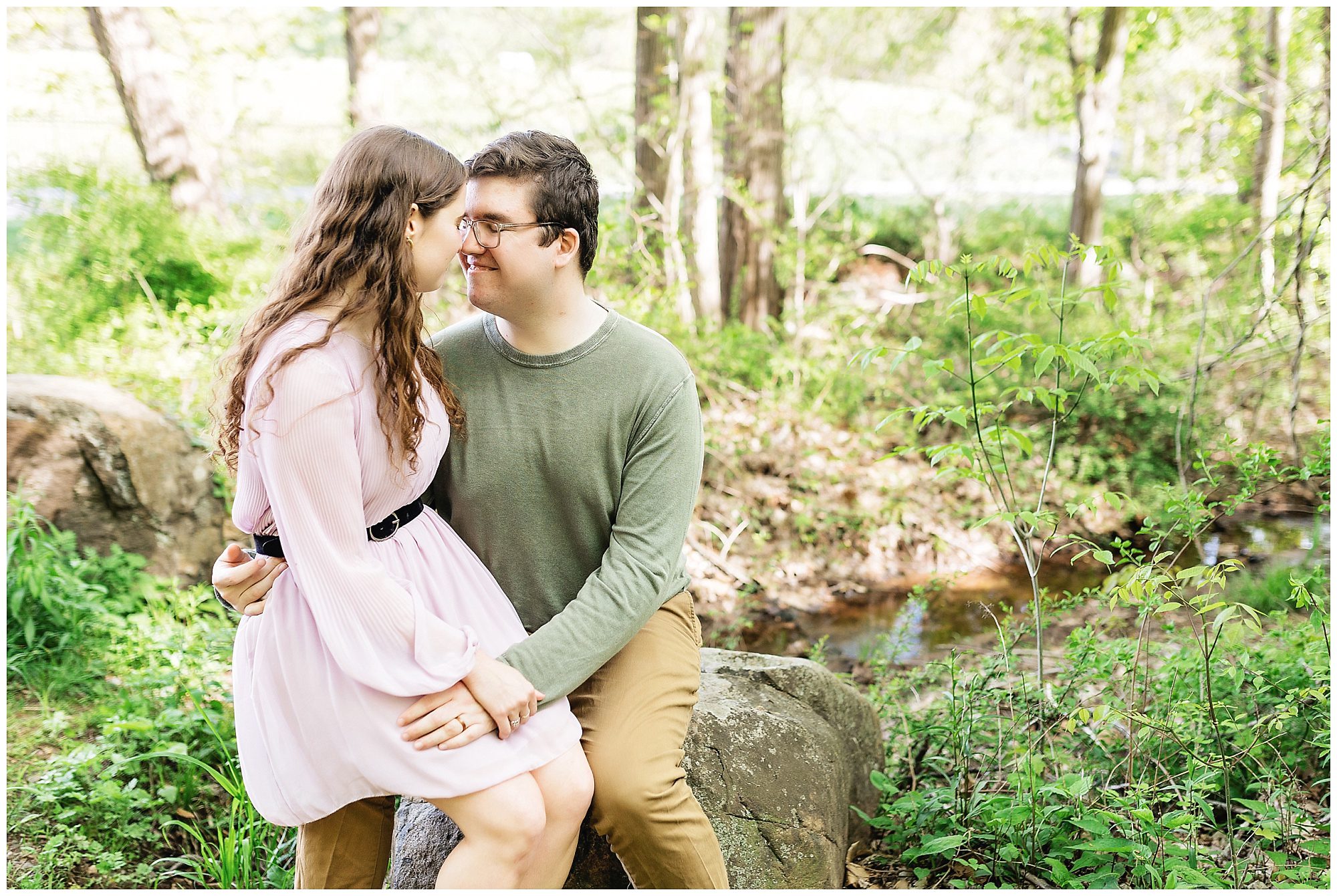 woman sitting on man's lap