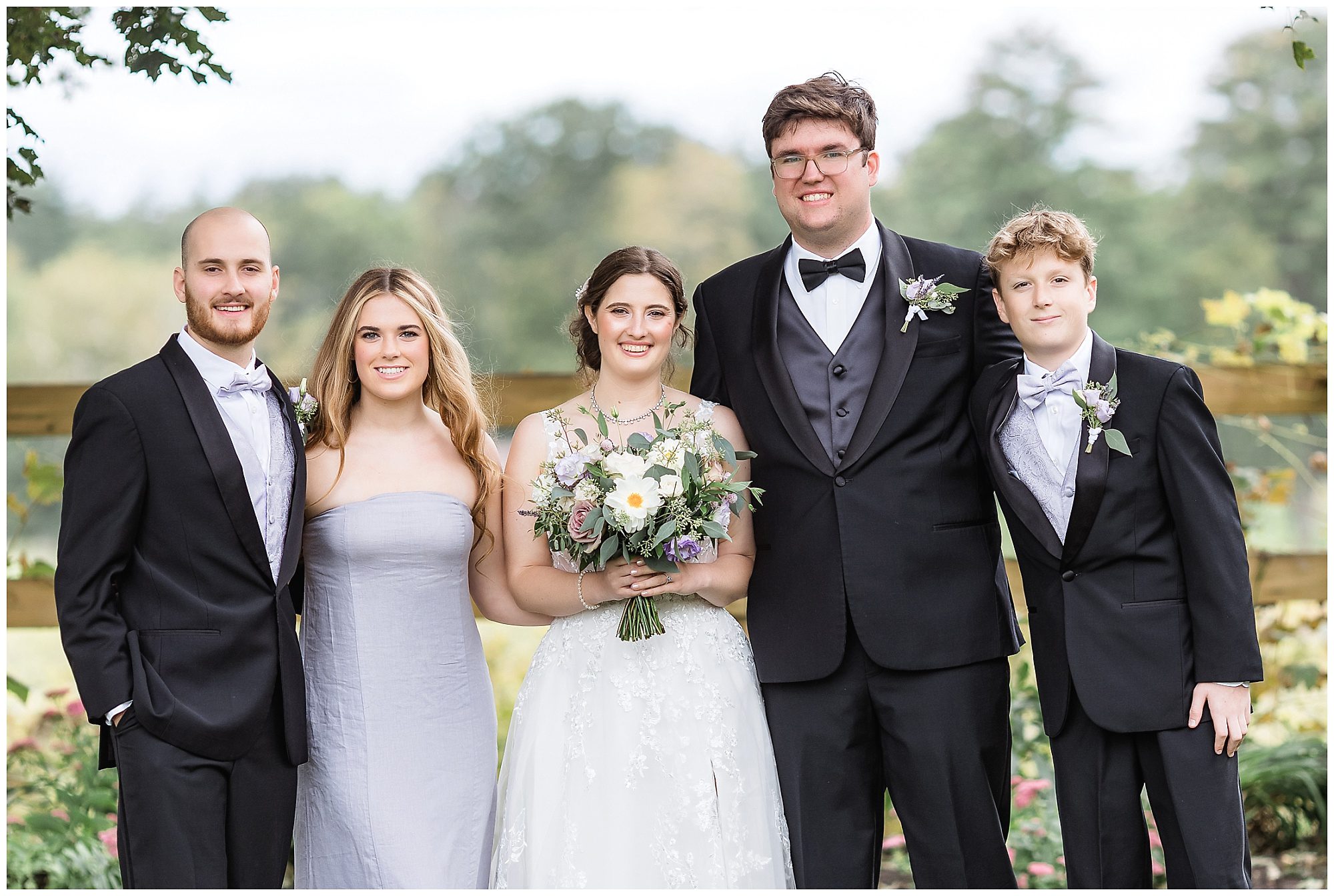 bride and groom with siblings
