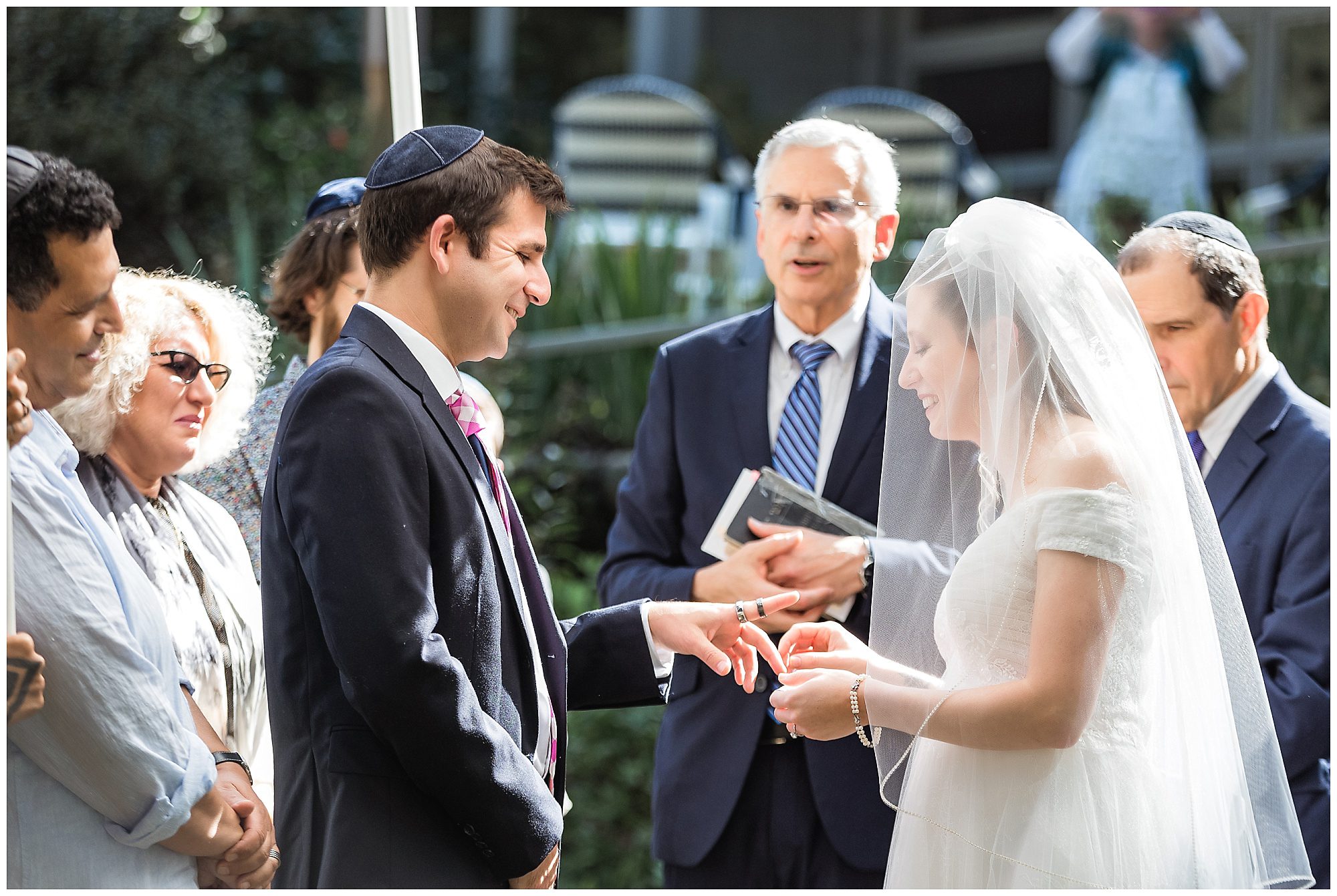 bride put rings on groom