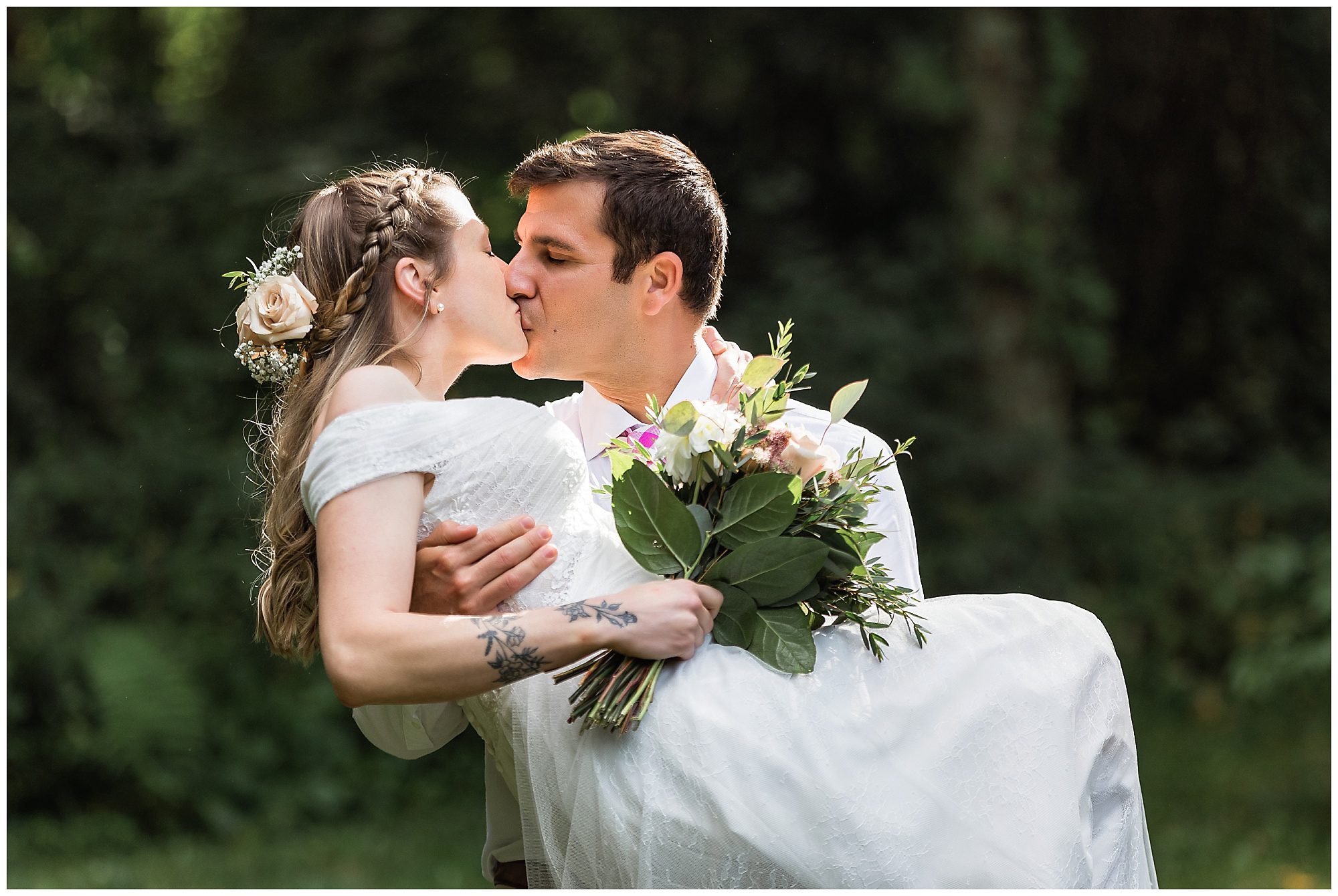 groom lifting bride
