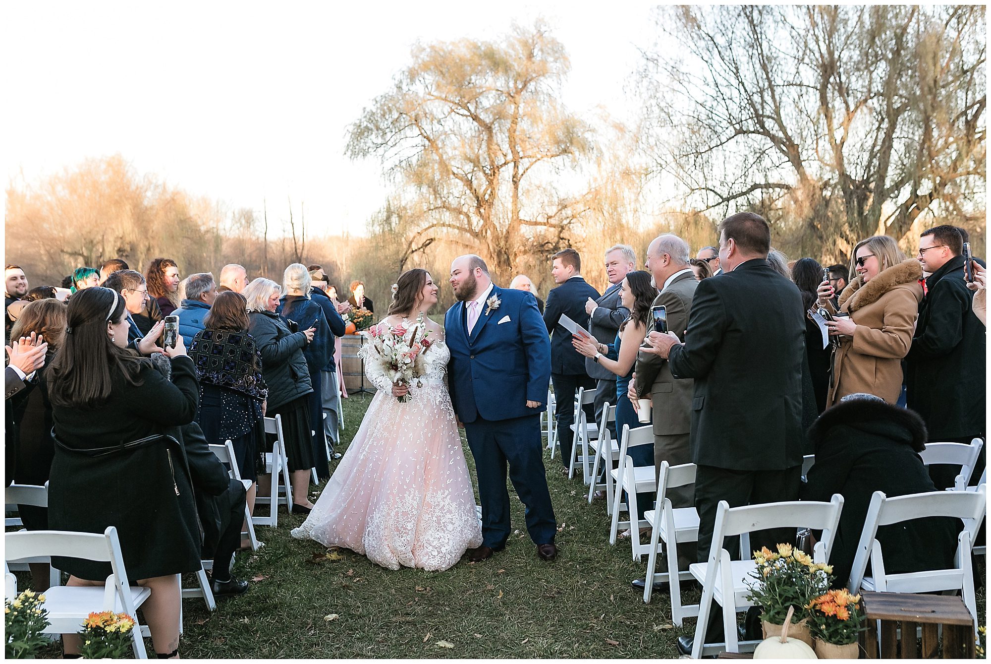 bride and groom walk up the aisle