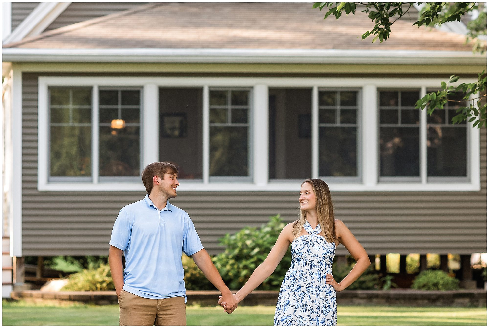 engaged couple at lake house