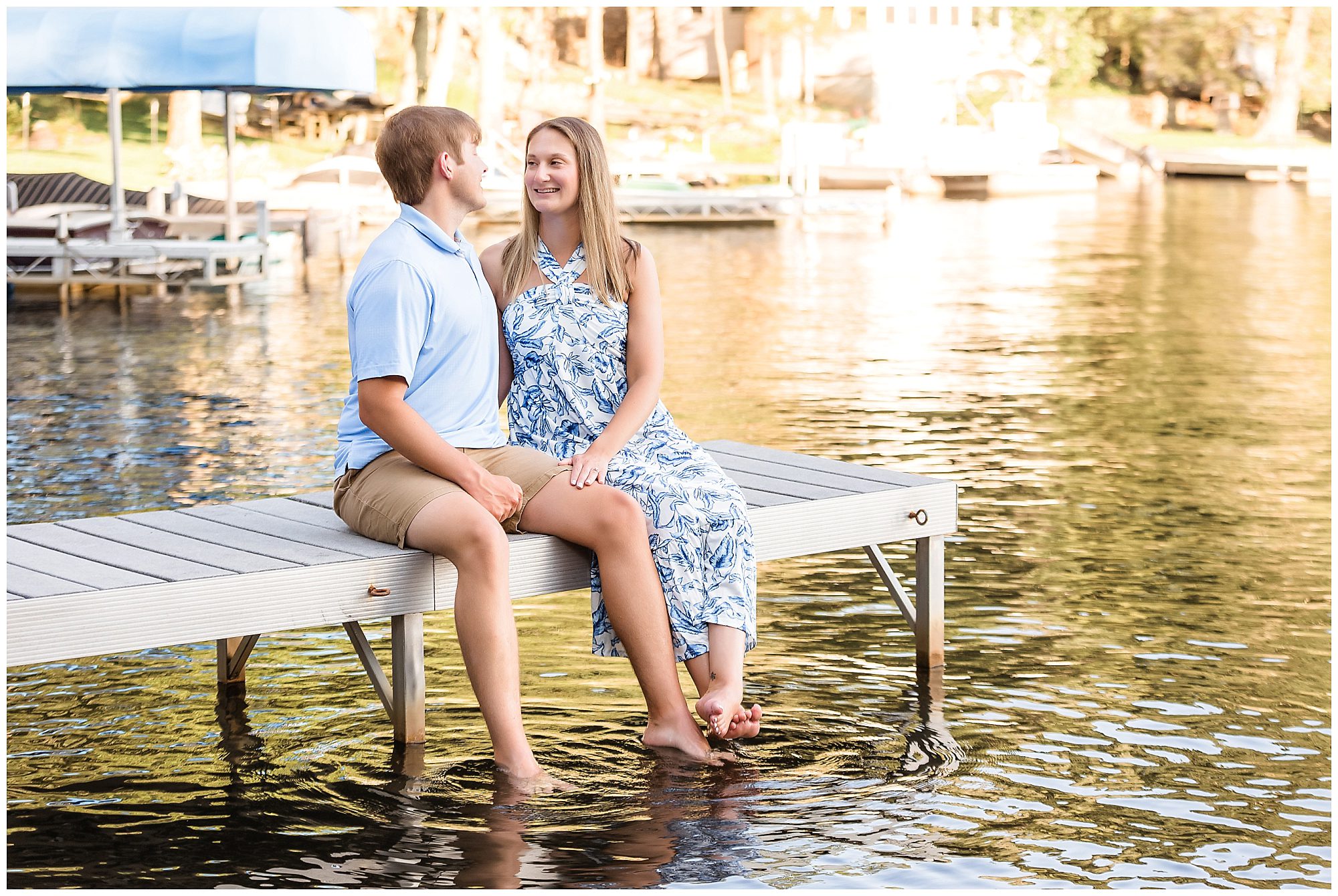engaged couple toes int he water