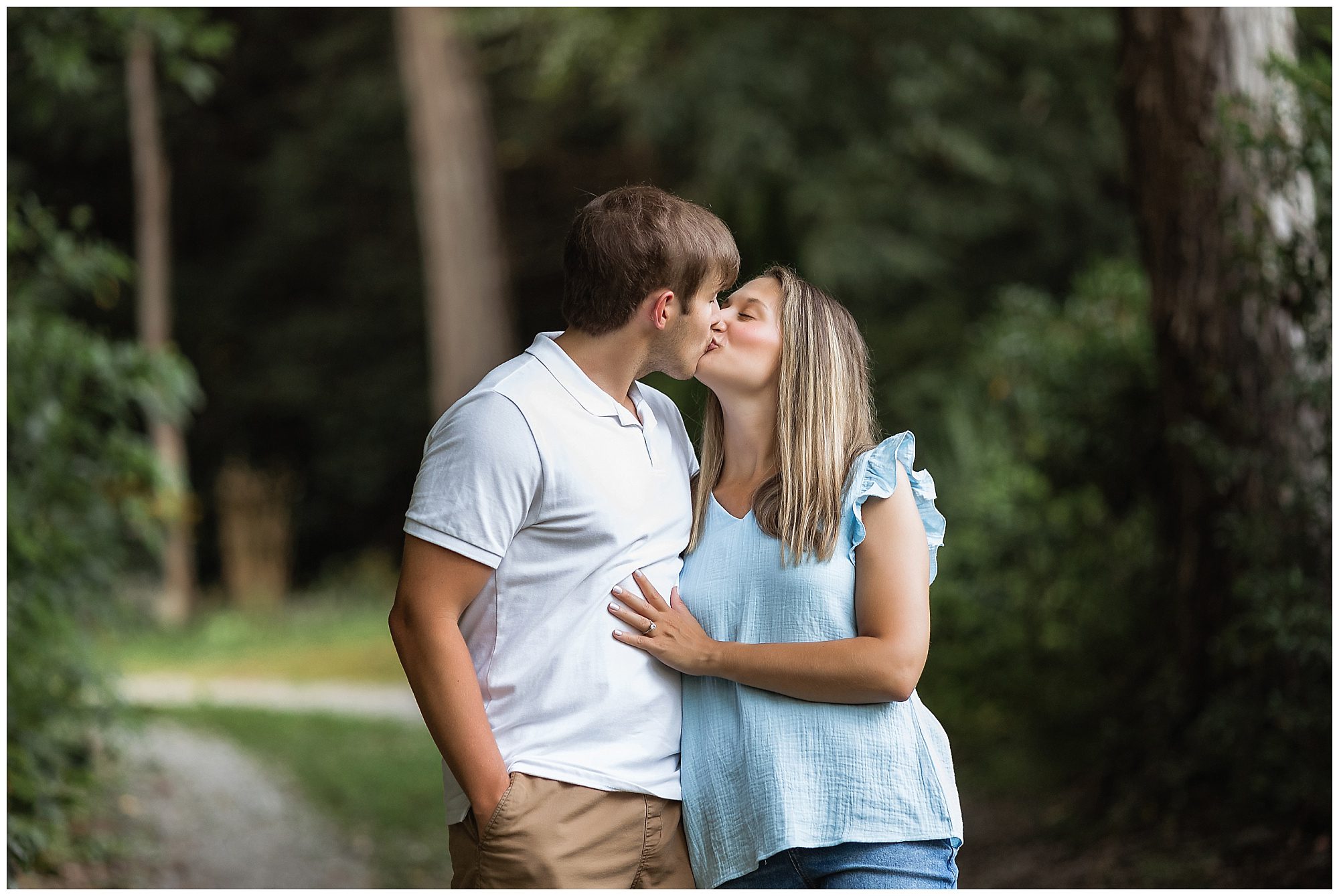 engaged couple in the woods