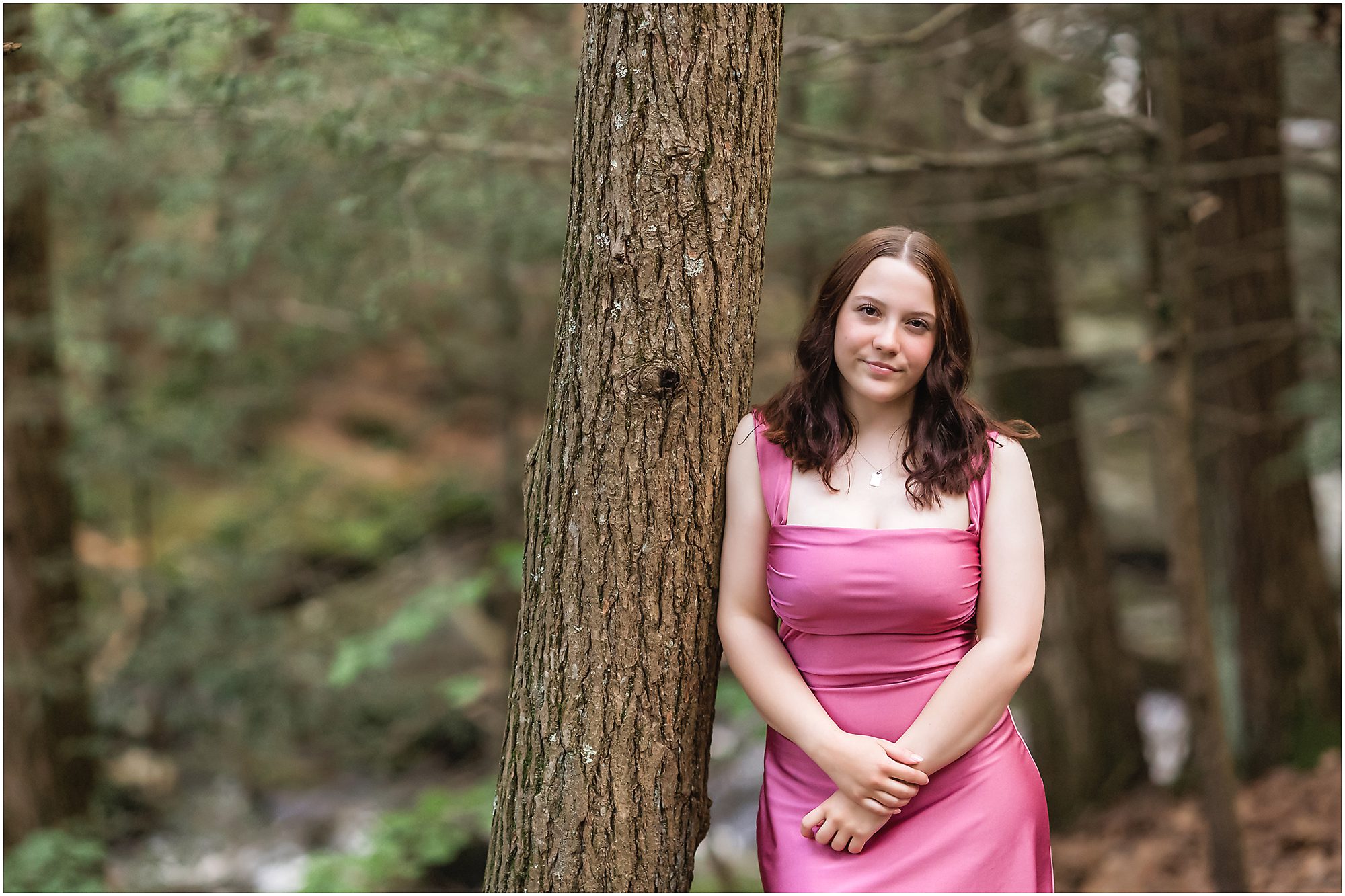 Senior portrait session at Enders Falls by a tree