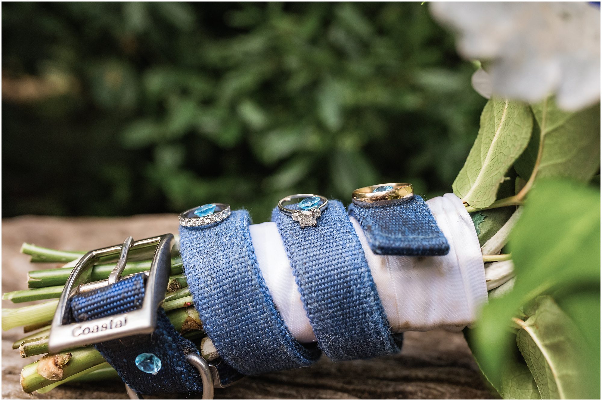 Dog collar with rings around bouquet for eloping couple