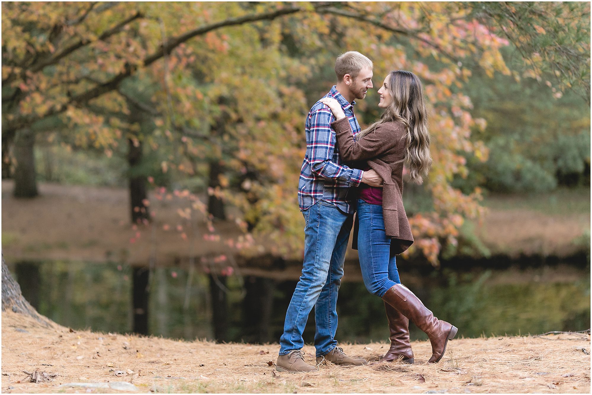 engagement session couple in the woods by a pond