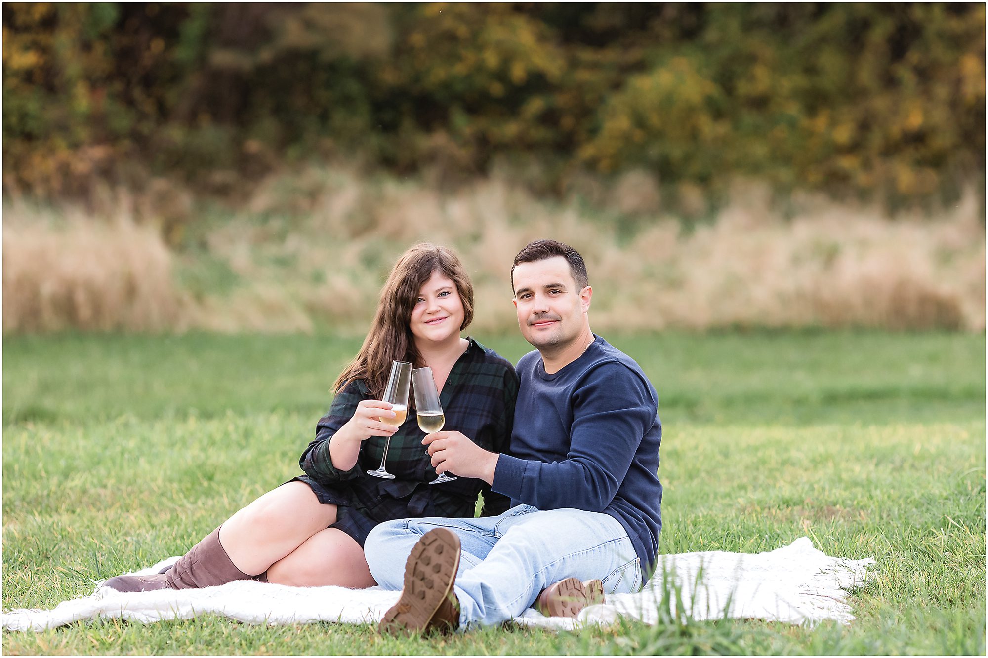 engagement session couple celebrating with champagne