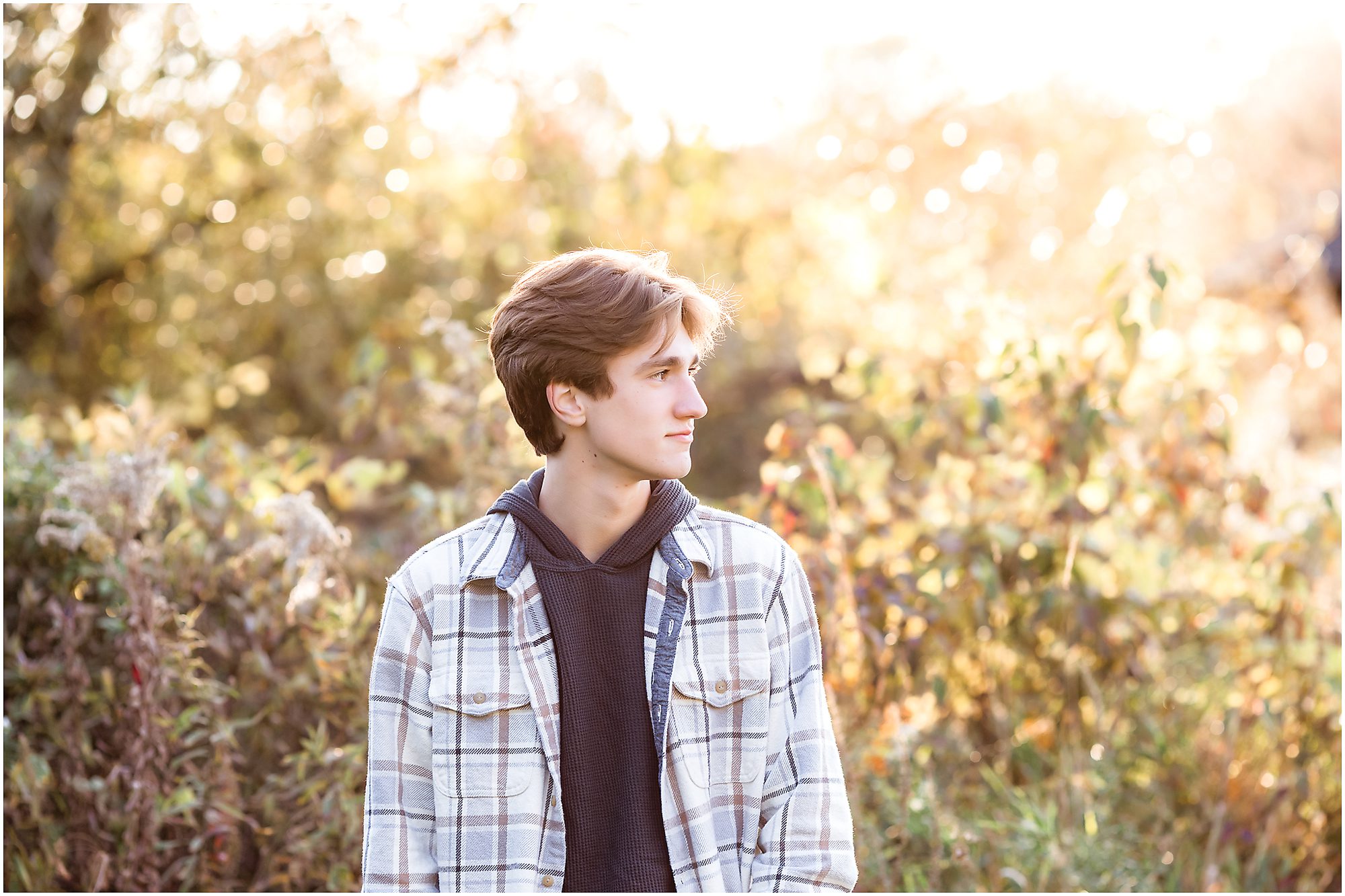 High school by senior session in a field in the fall
