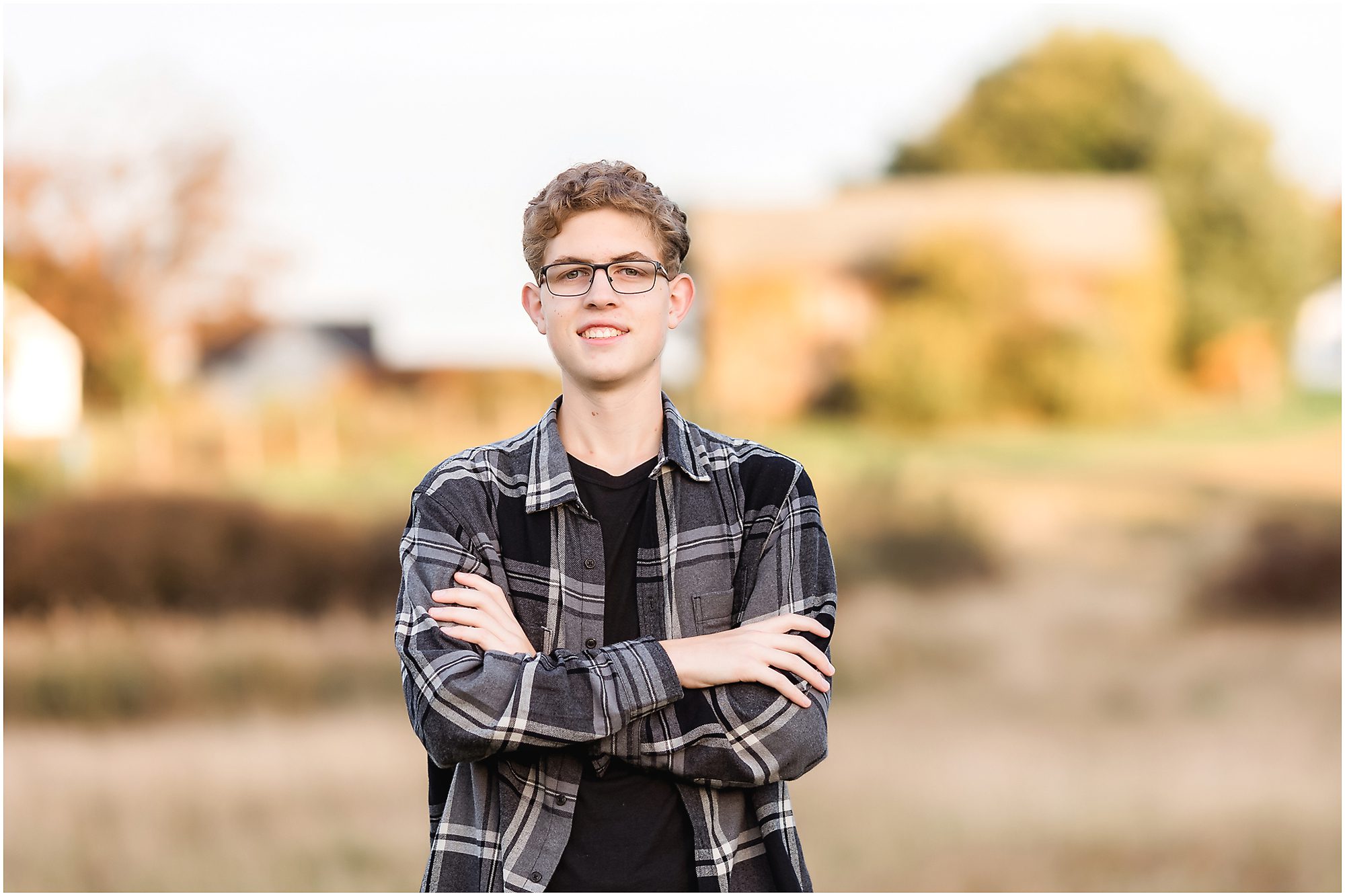 High school boy senior session in a garden