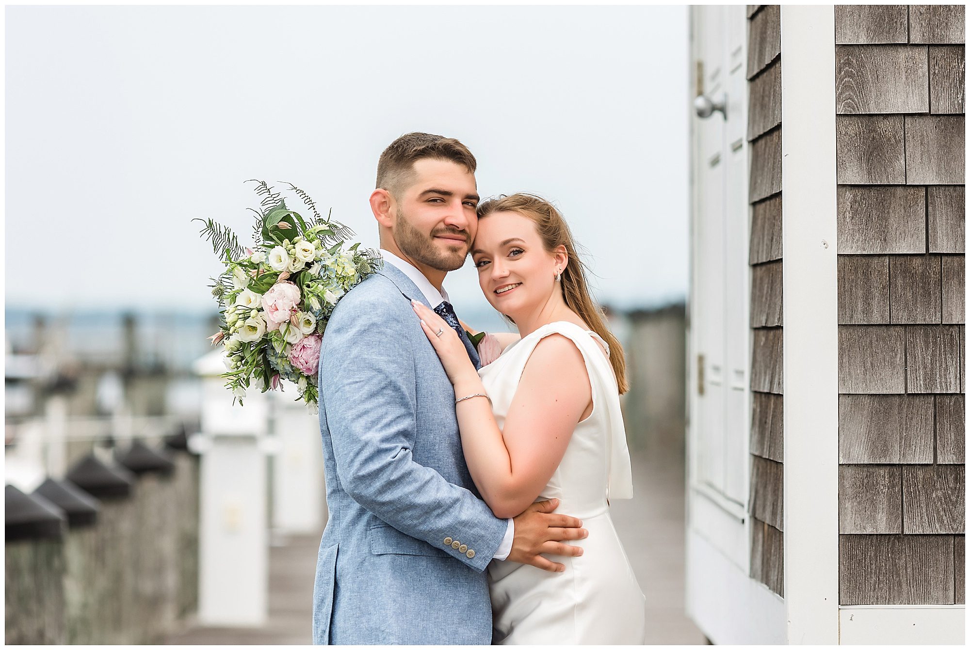 Bride and groom portraits at Saybrook Point marina