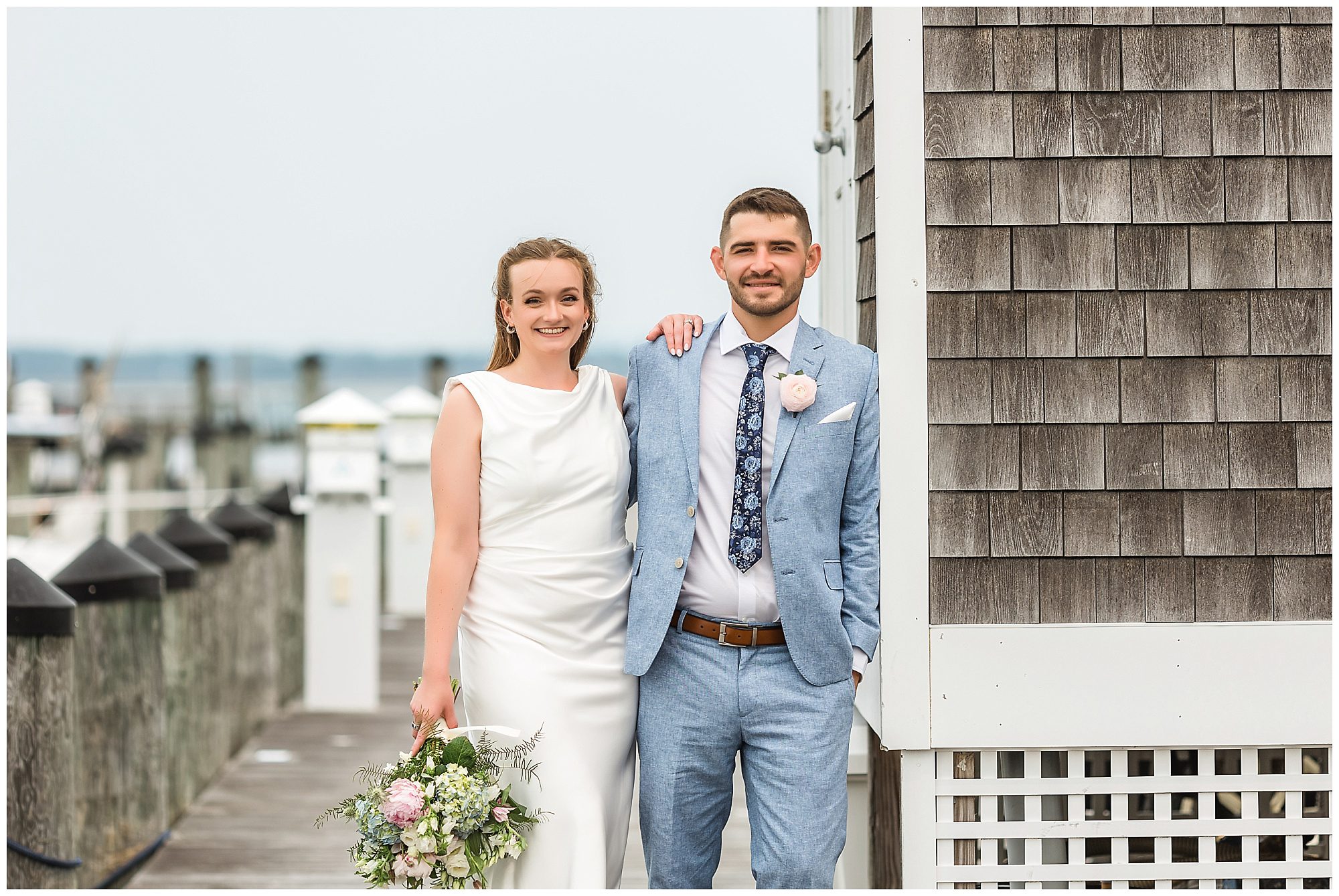 Bride and groom portraits at Saybrook Point marina