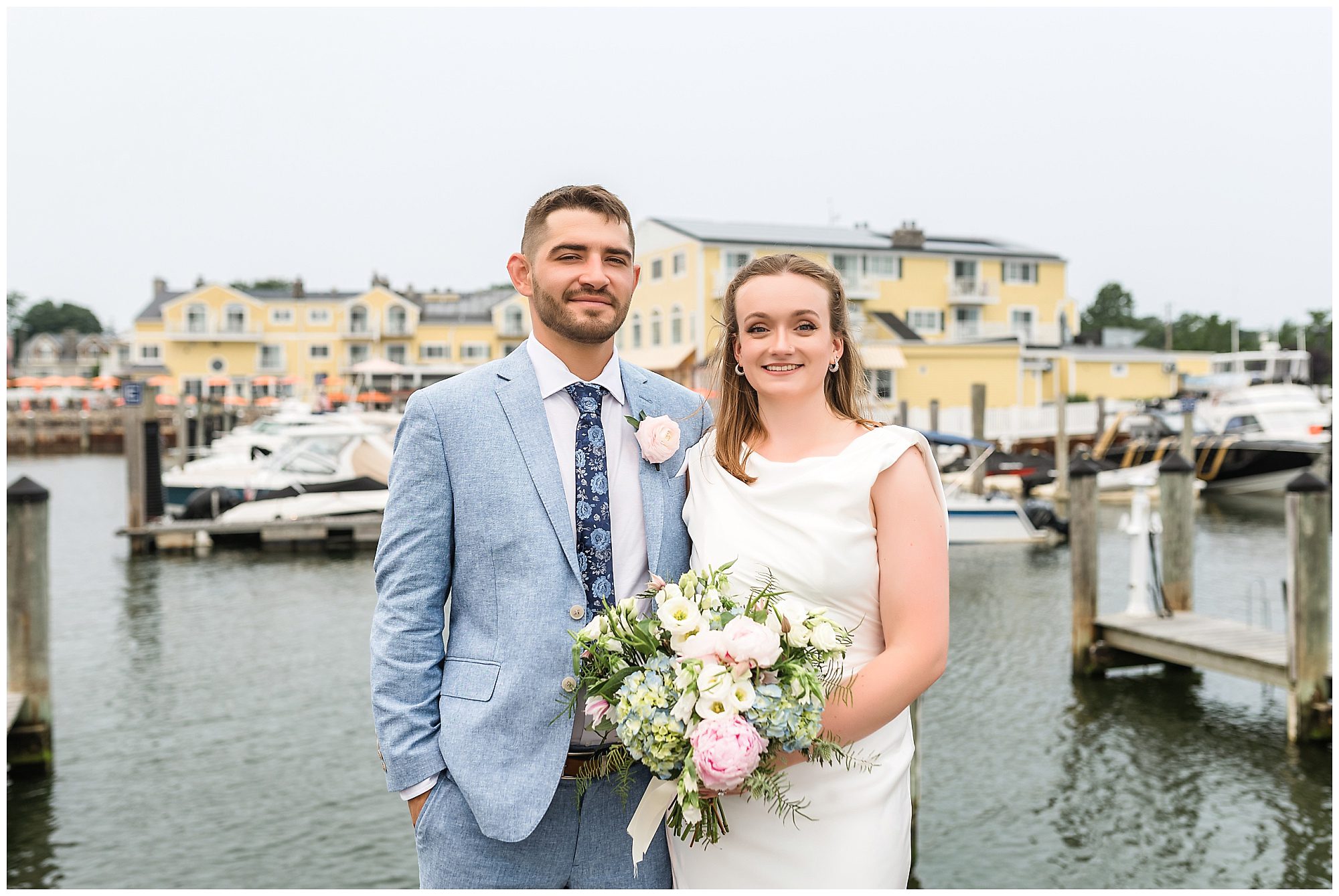 Bride and groom portraits at Saybrook Point marina